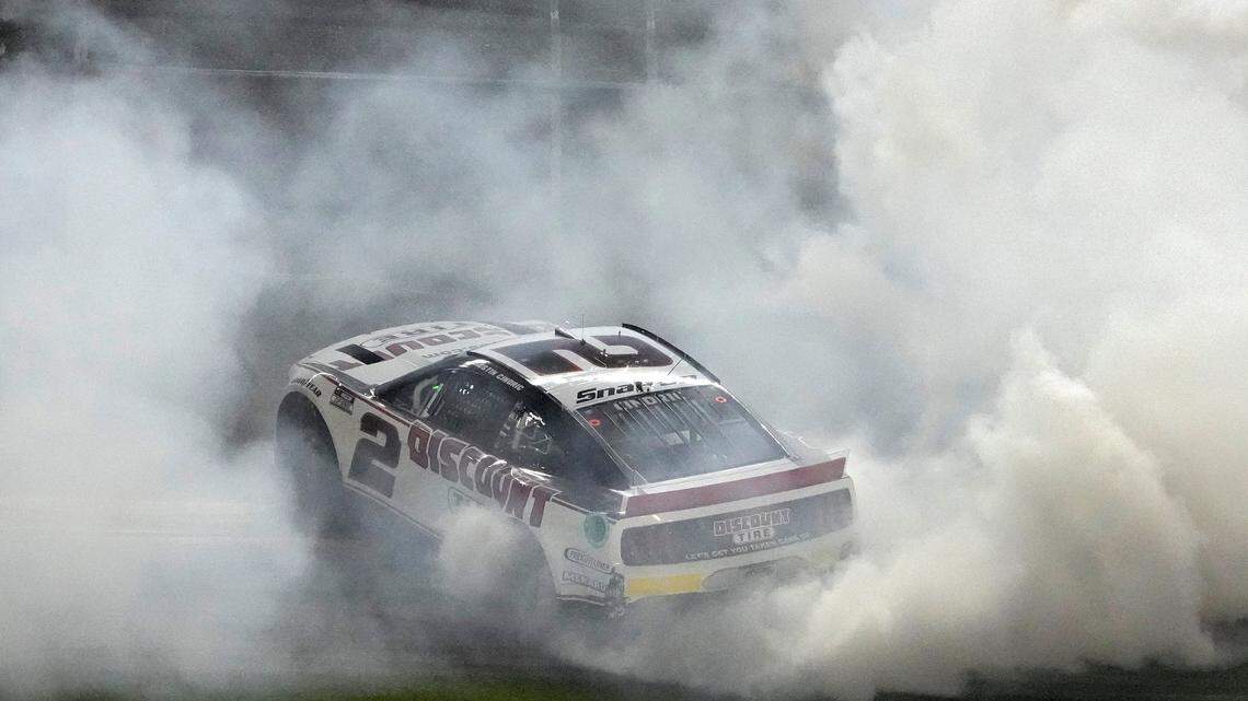 Austin Cindric celebrates after winning the NASCAR Daytona 500 auto race Sunday, Feb. 20, 2022, at Daytona International Speedway in Daytona Beach, Fla. (AP Photo/Chris O’Meara)