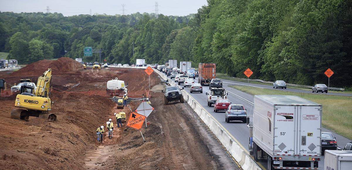 Traffic heads south on I-77 as construction continued earlier this summer at Exit 23 on the controversial I-77 toll lanes project.
