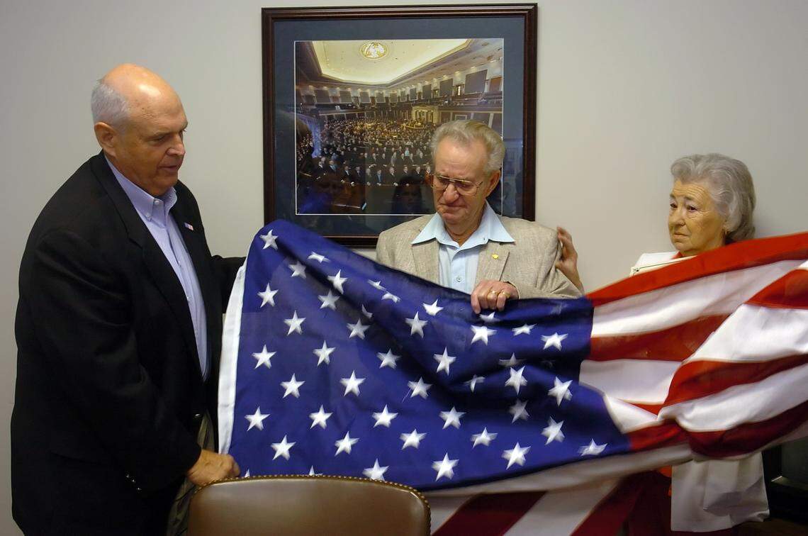 In 2005, Congressman Robin Hayes gave a flag to WWII veteran Herman Caudill Friday at Hayes’ office in Concord as Caudill’s wife Jessie looked on. The flag was flown over the Capitol in Washington in honor of Caudill. 