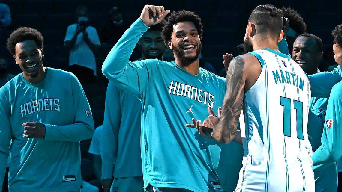Charlotte Hornets forward Miles Bridges, right, jokes around with his teammates prior to action against the Dallas Mavericks on Thursday, October 13, 2021 at Spectrum Center in Charlotte, NC.