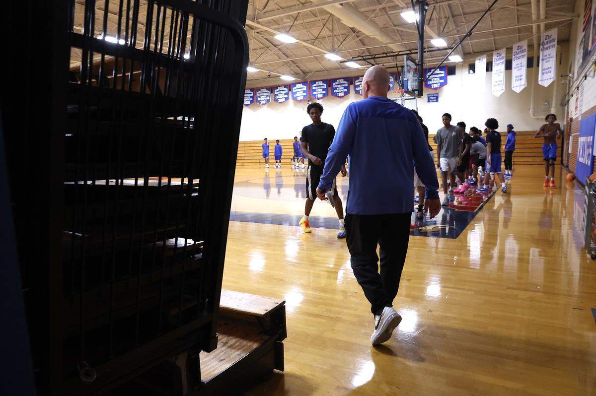North Meck Vikings head basketball coach Duane Lewis walks onto the court to begin practice on Wednesday, November 5, 2025. Lewis has won four NCHSAA championships in his career at the school. The 2025 North Meck boys basketball team is ranked No.1 in the preseason sweet 16.
