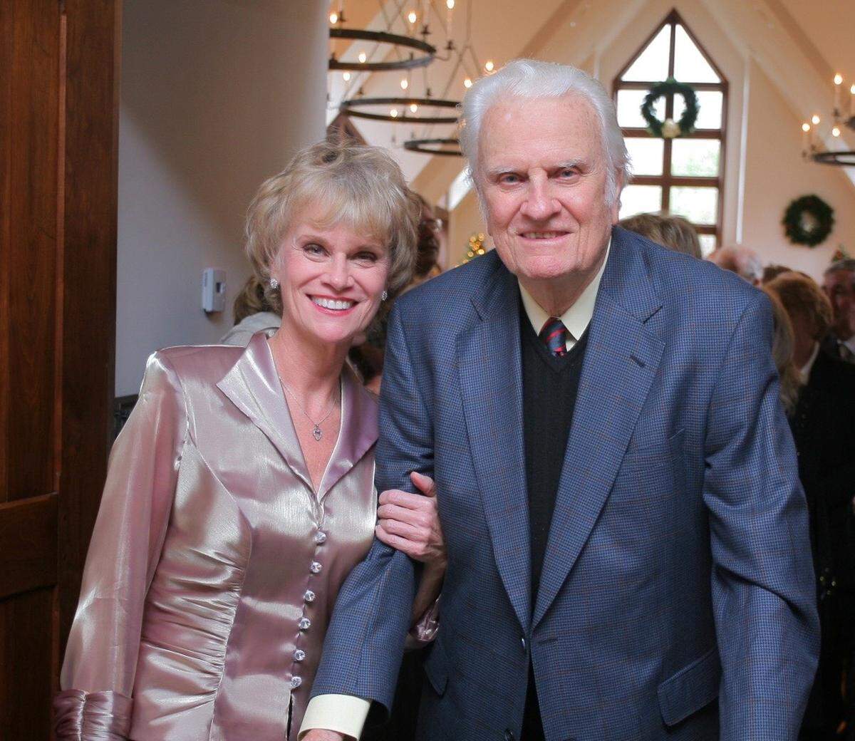 Ruth Graham, seen here with her famous father, was born and lived in the cottage that is up for sale.