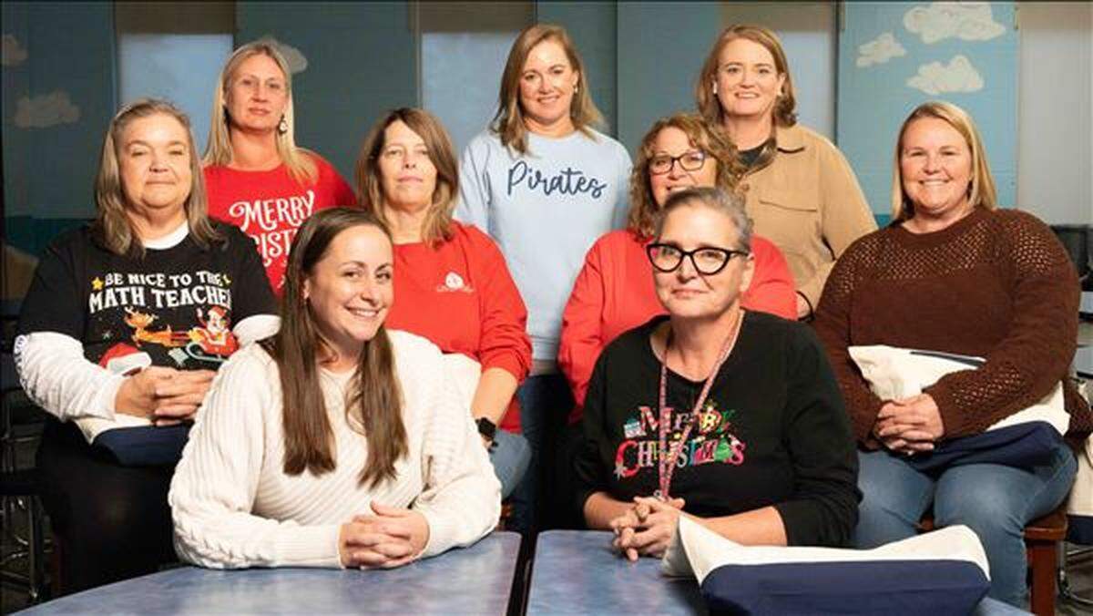 The nine women work together at Swansboro Elementary in Onslow County and they invested about 33 cents each to buy the $3 Power Play ticket.