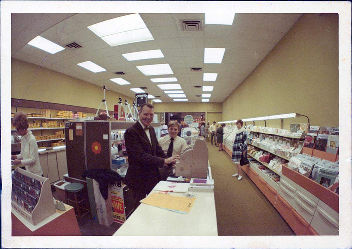 Neil Biggs tends the cash register during the mid-1960s at his camera shop in Charlottetown Mall.