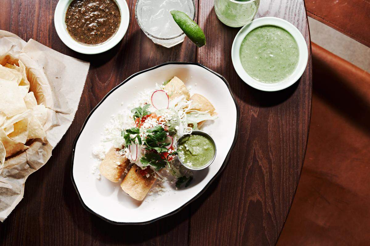 Superica’s Chicken Verde enchiladas are $16 and include morita chile braised chicken, salsa verde, sourcream and cilantro.