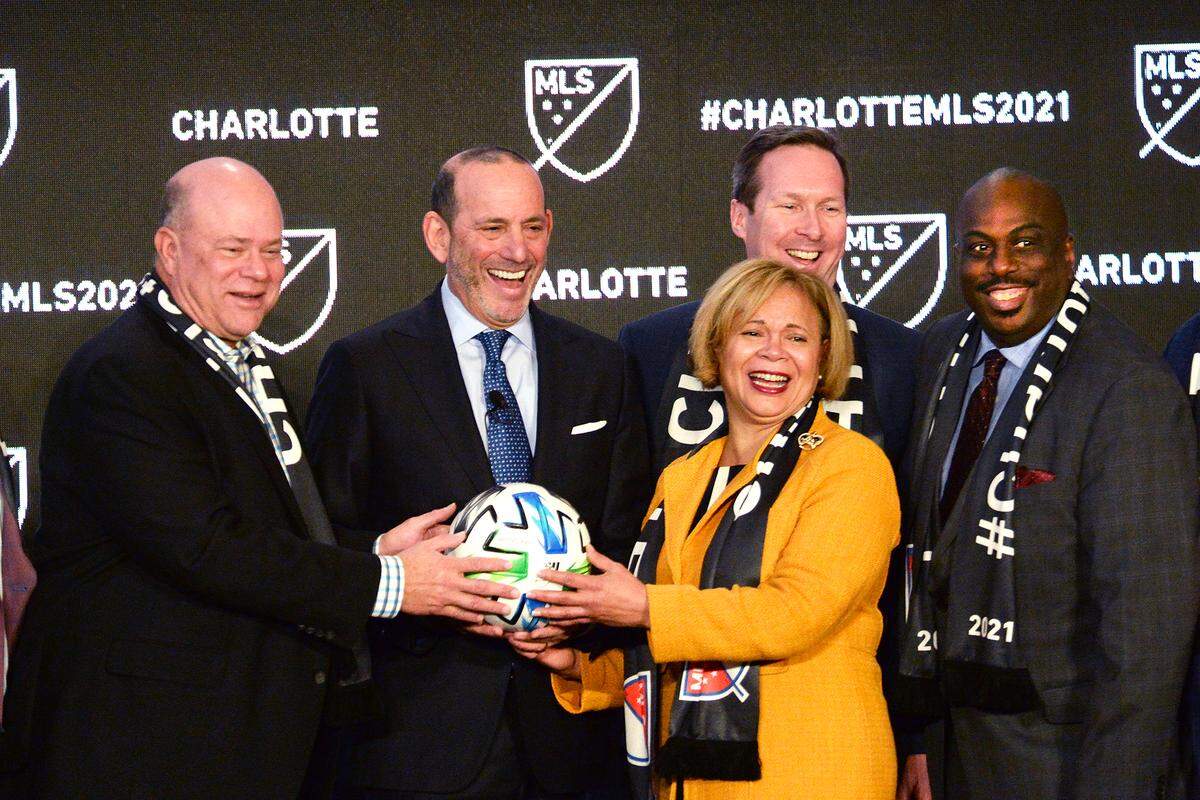 (L-R) David Tepper, team owner, Don Garber, MLS commissioner, and Vi Lyles, Charlotte mayor were joined on stage after the announcement as Charlotte as the 30th team in Major League Soccer.