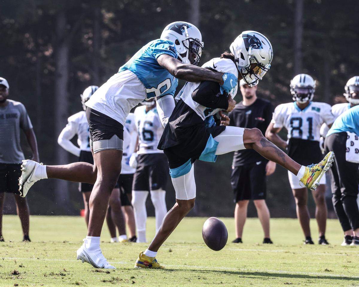 Carolina Panthers Jaycee Horn, left, grabs Robby Anderson during a drill at day 5 of the Carolina Panthers training camp at Wofford College in Spartanburg, S.C., on Monday, August 2, 2021.
