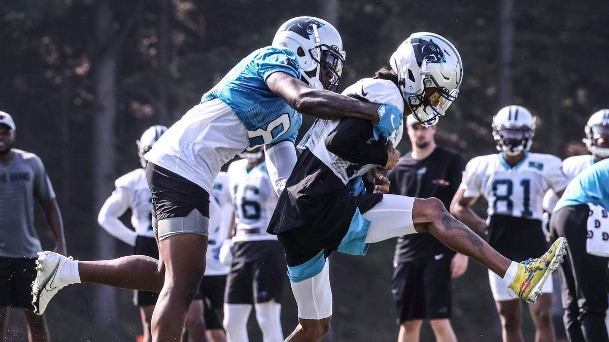 Carolina Panthers cornerback Jaycee Horn, left, defends Robby Anderson during a drill at training camp at Wofford College in Spartanburg, S.C., on Monday.