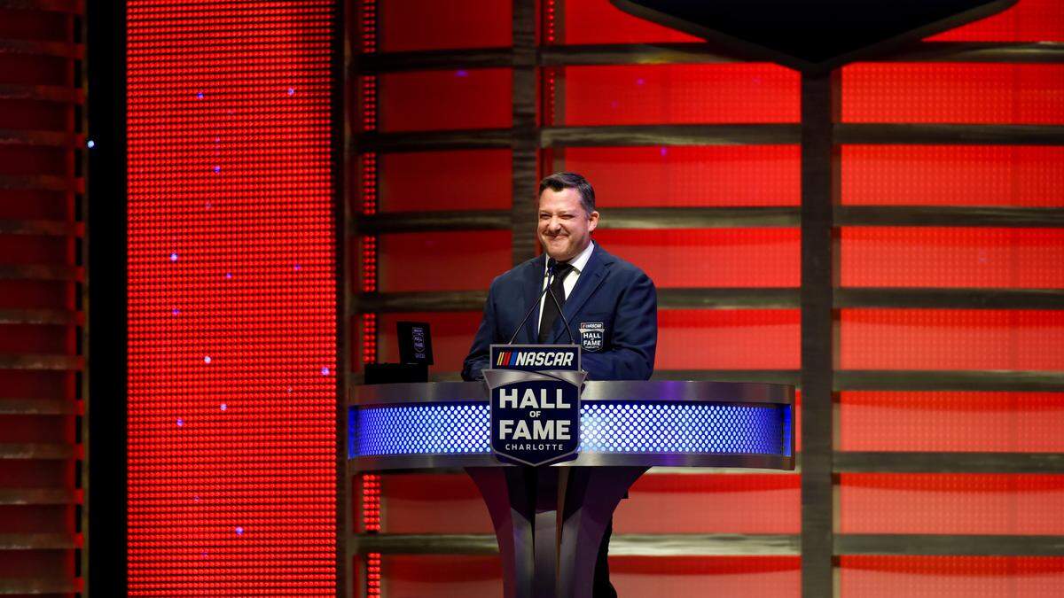 NASCAR Hall of Fame inductee Tony Stewart talks about his career in racing during the induction ceremony in Charlotte, N.C., Friday, Jan. 31, 2020. (AP Photo/Mike McCarn)