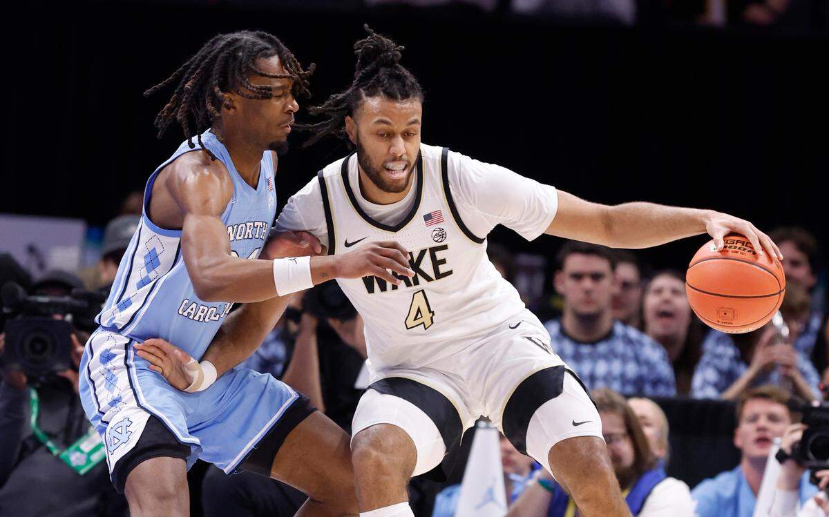 Wake Forest’s Efton Reid III (4) works against North Carolina’s Jae’Lyn Withers (24) during the first half of UNC’s game against Wake Forest in the quarterfinals of the 2025 ACC Men’s Basketball Tournament at the Spectrum Center in Charlotte, N.C., Thursday, March 13, 2025.