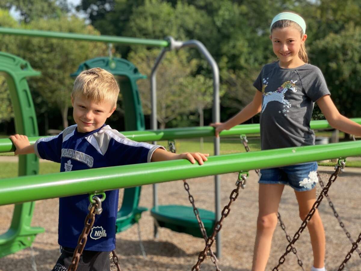 Isabella, 11, and Isaac, 5, play at at Butterfly Park during their fist visit to a public park since March. 