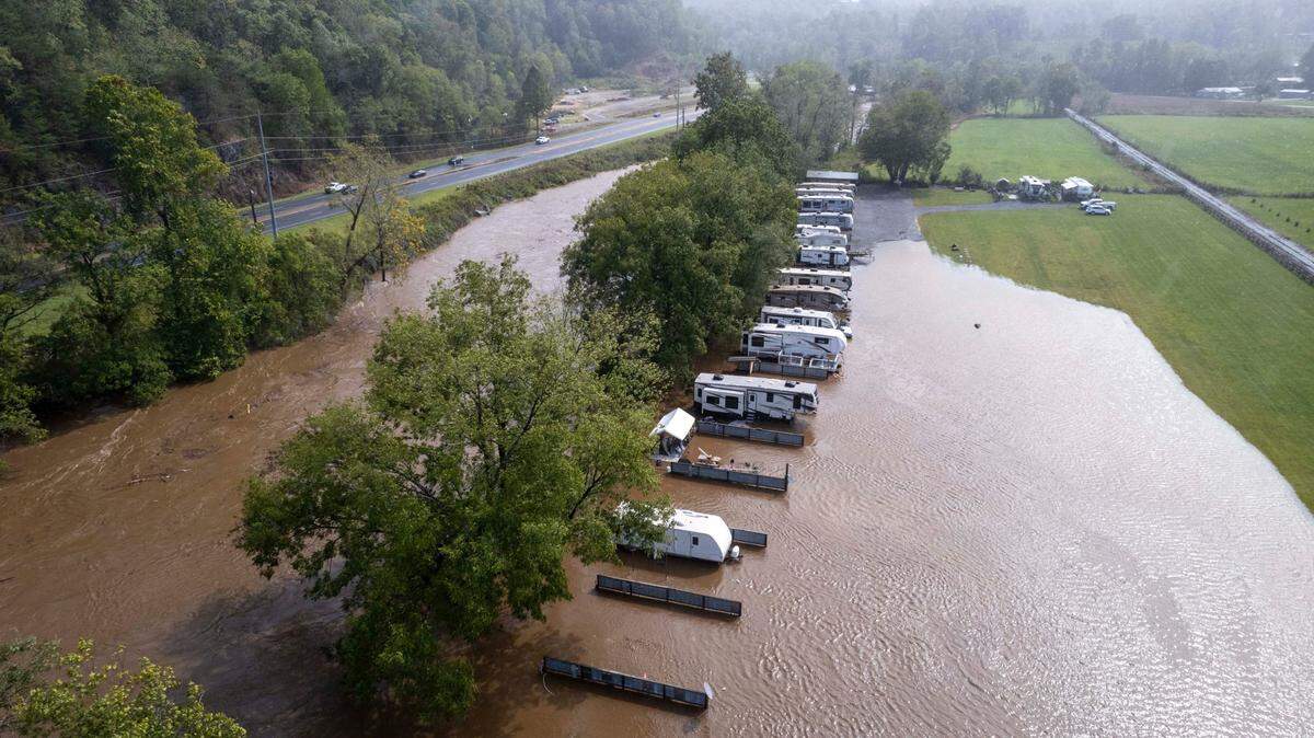 Water from the Tuckasegee River floods the River and Rails RV Park in Whittier on Friday, Sept. 27, 2024, as the remnants of Hurricane Helene move through North Carolina.