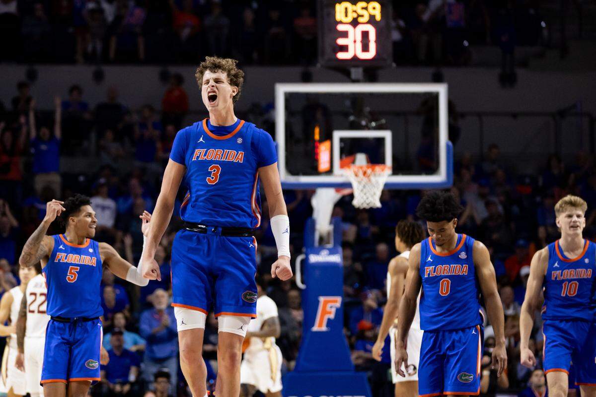 Nov 17, 2023; Gainesville, Florida, USA; Florida Gators center Micah Handlogten (3) celebrates during a timeout during the first half against the Florida State Seminoles at Exactech Arena at the Stephen C. O’Connell Center.