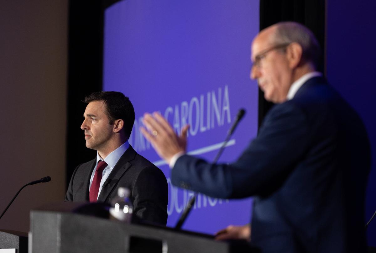 Jeff Jackson, left, debates Dan Bishop in the Attorney General race at the Charlotte Convention Center in Charlotte, N.C., on Friday, June 21, 2024.