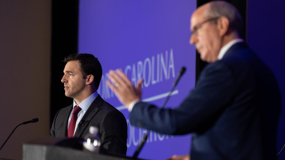 Jeff Jackson, left, debates Dan Bishop in the Attorney General race at the Charlotte Convention Center in Charlotte, N.C., on Friday, June 21, 2024.