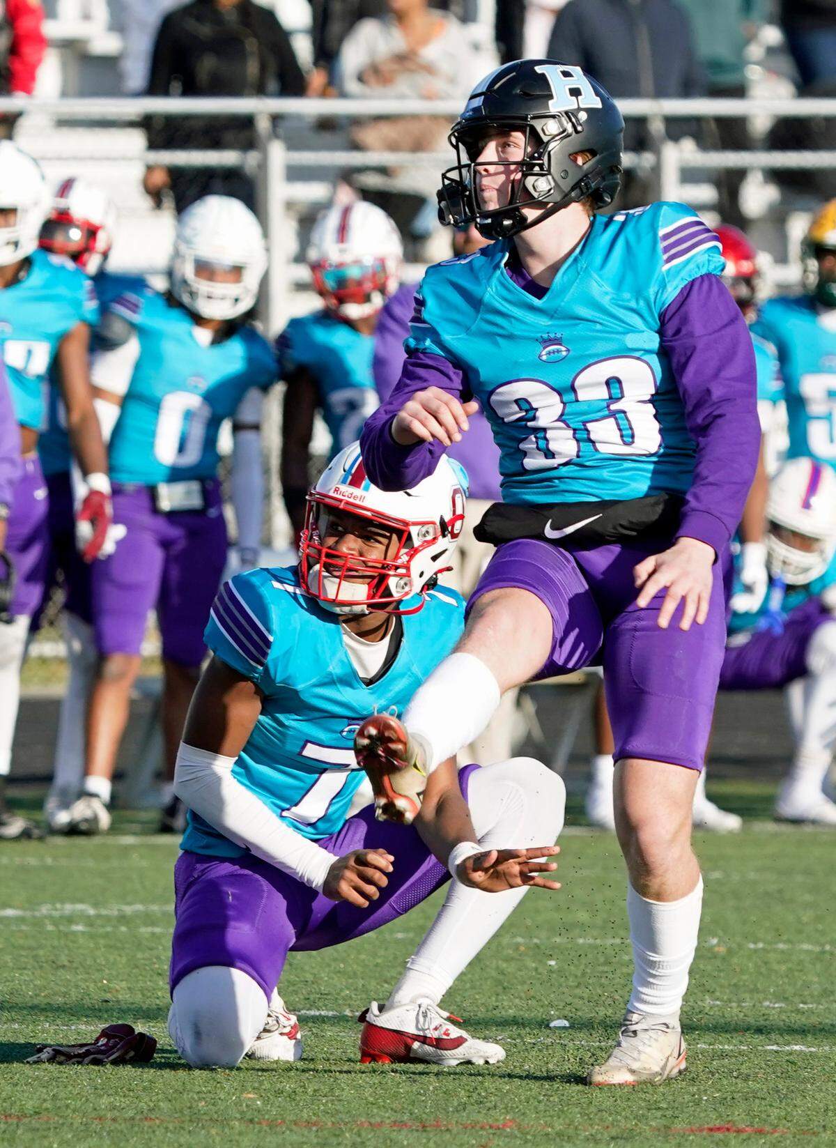 West kicker Kandler Happe of Hough High School watches as hiis 24-yard field goal clears the uprights during the overtime period in Saturday’s Queen City Senior Bowl high school football game at Olympic High School in Charlotte, N.C. Holding the ball is Solomon Ford of Olympic High School. (CREDIT: Bill Kiser/Special to the Charlotte Observer)