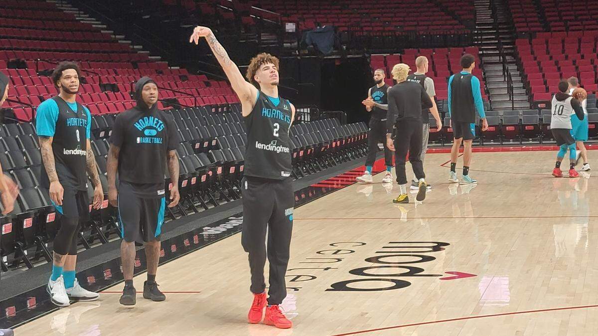 LaMelo Ball follows through on a shot during the Charlotte Hornets’ shootaround at the Moda Center on Friday. Ball returned after a six-game absence while ill.
