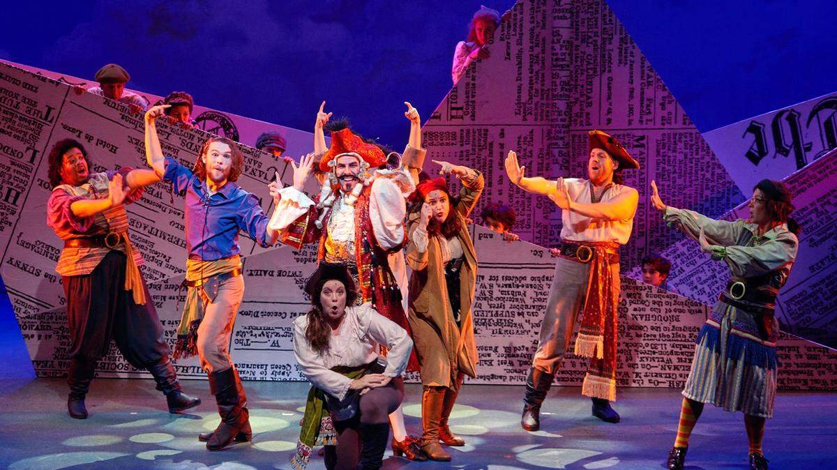 Caleb Sigmon as Captain Hook, surrounded by pirates, in the Children’s Theatre of Charlotte production of “Peter Pan.”