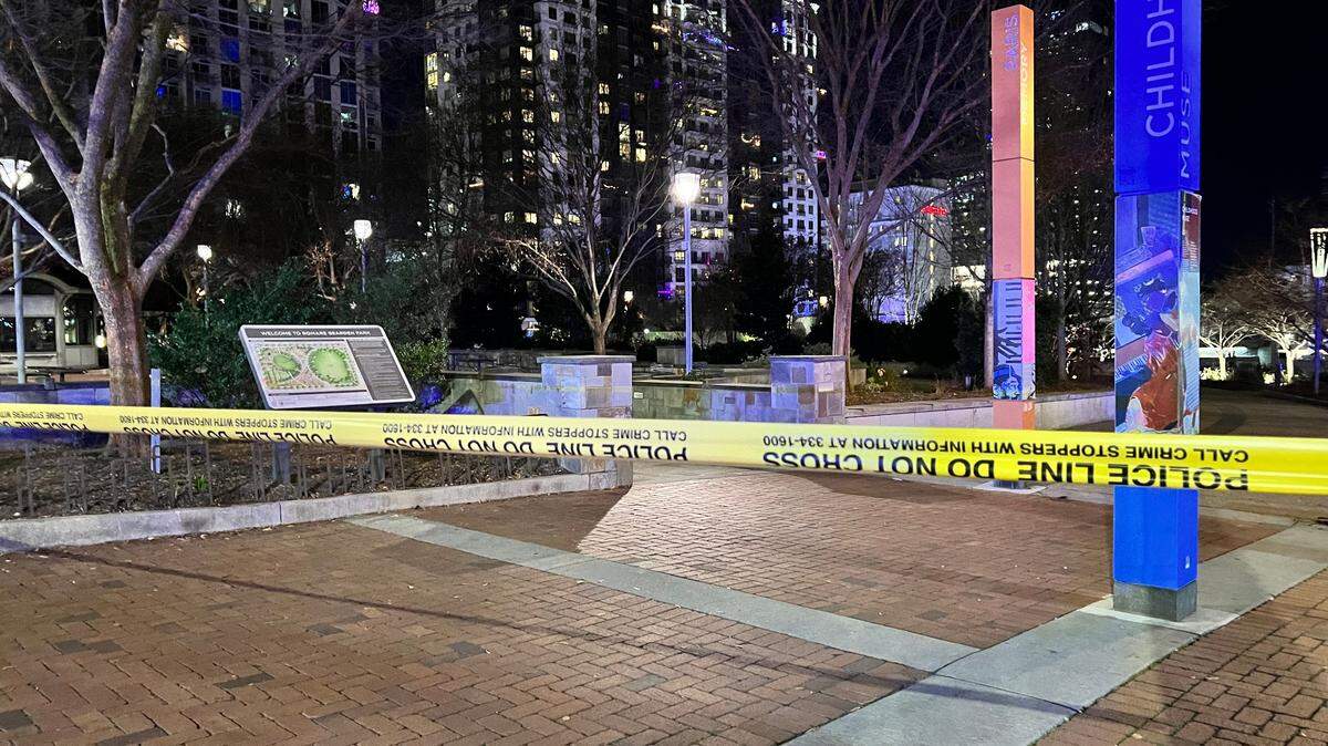 Crime scene tape stretches across Romare Bearden Park after a shooting on New Year’s Eve in uptown Charlotte left five people injured. A 19-year-old man was arrested for the crime.
