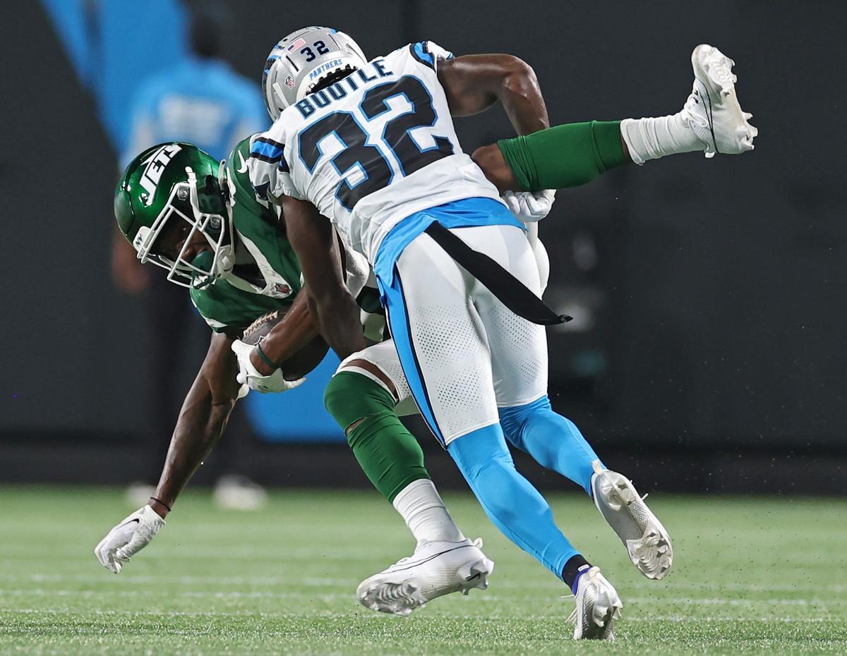 Carolina Panthers cornerback Dicaprio Bootle makes the stop on New York Jets wide receiver Brandon Smith during fourth quarter action at Bank of America Stadium in Charlotte, NC on Saturday, August 17, 2024. The Jets defeated the Panthers 15-12.