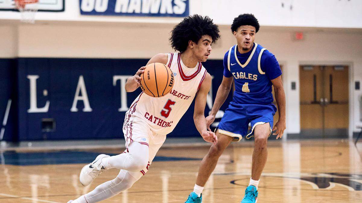Charlotte Catholic guard Mack Jordan (5) looks for a scoring option late in the second half of the 2025 Charlotte Latin Invitational Finals against Charlotte Catholic.