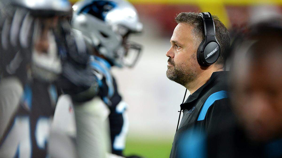 Carolina Panthers head coach Matt Rhule, right, survived the NFL’s “Black Monday” and will be back for another season.
