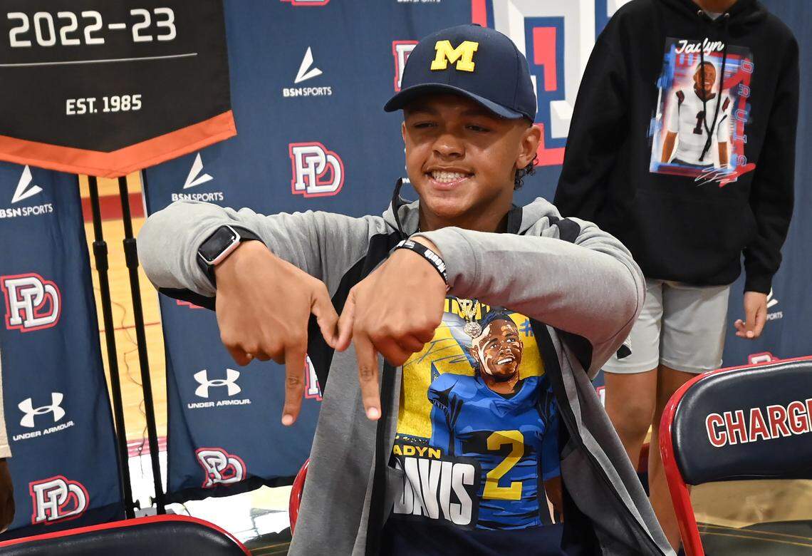 Providence Day quarterback Jadyn Davis displays a large “M” following his announcement that he will attend the University of Michigan to play football on Friday, March 31, 2023. Davis is a top 15 national recruit.