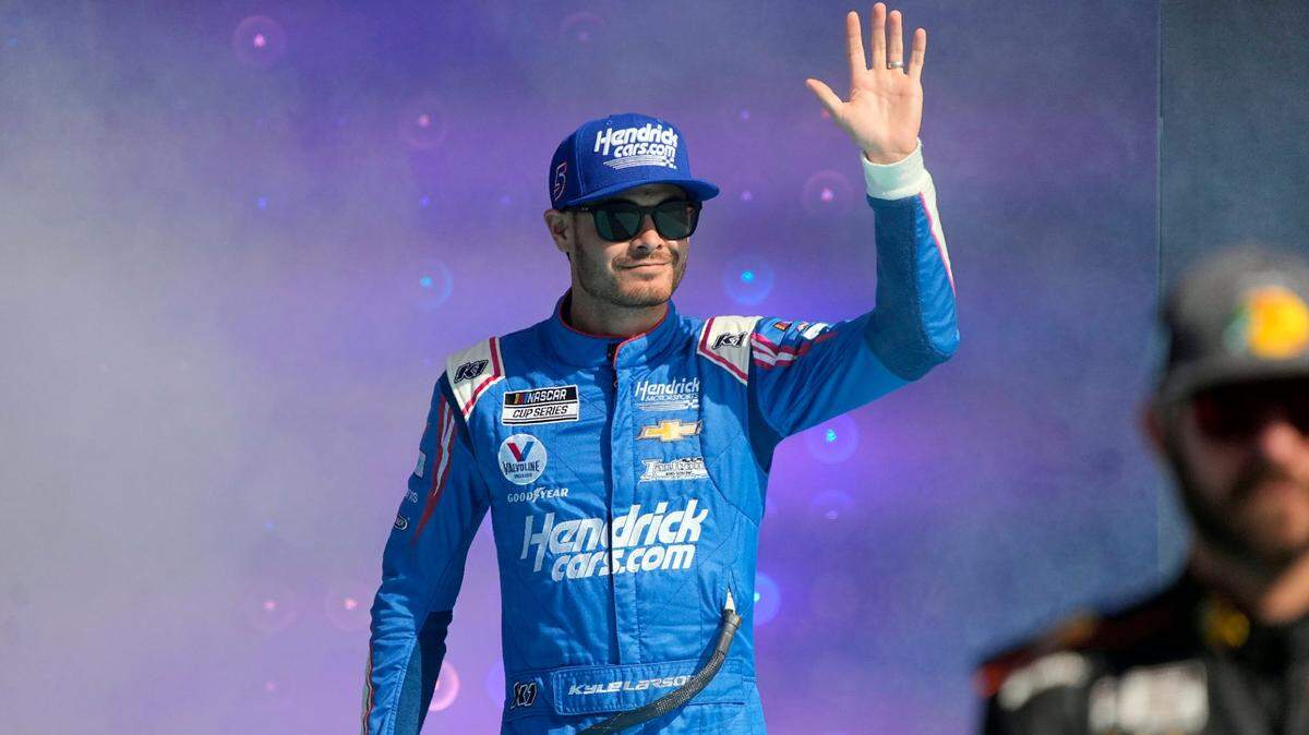 Kyle Larson is introduced to the fans before a NASCAR Cup Series auto race on Sunday, Nov. 7, 2021, in Avondale, Ariz. (AP Photo/Rick Scuteri)