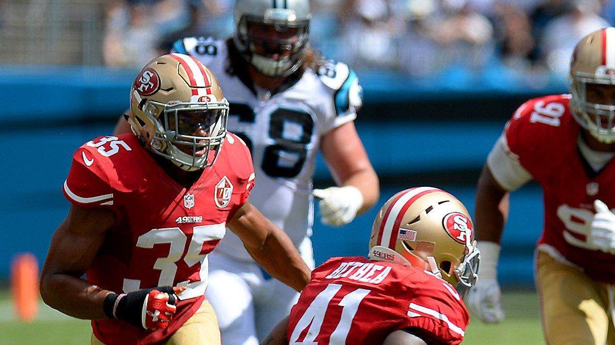 Carolina Panthers quarterback Cam Newton, right, rushes for yardage as San Francisco 49ers safety Antoine Bethea, left, looks to make the tackle during second quarter action at Bank of America Stadium in Charlotte, NC on Sunday, September 18, 2016.