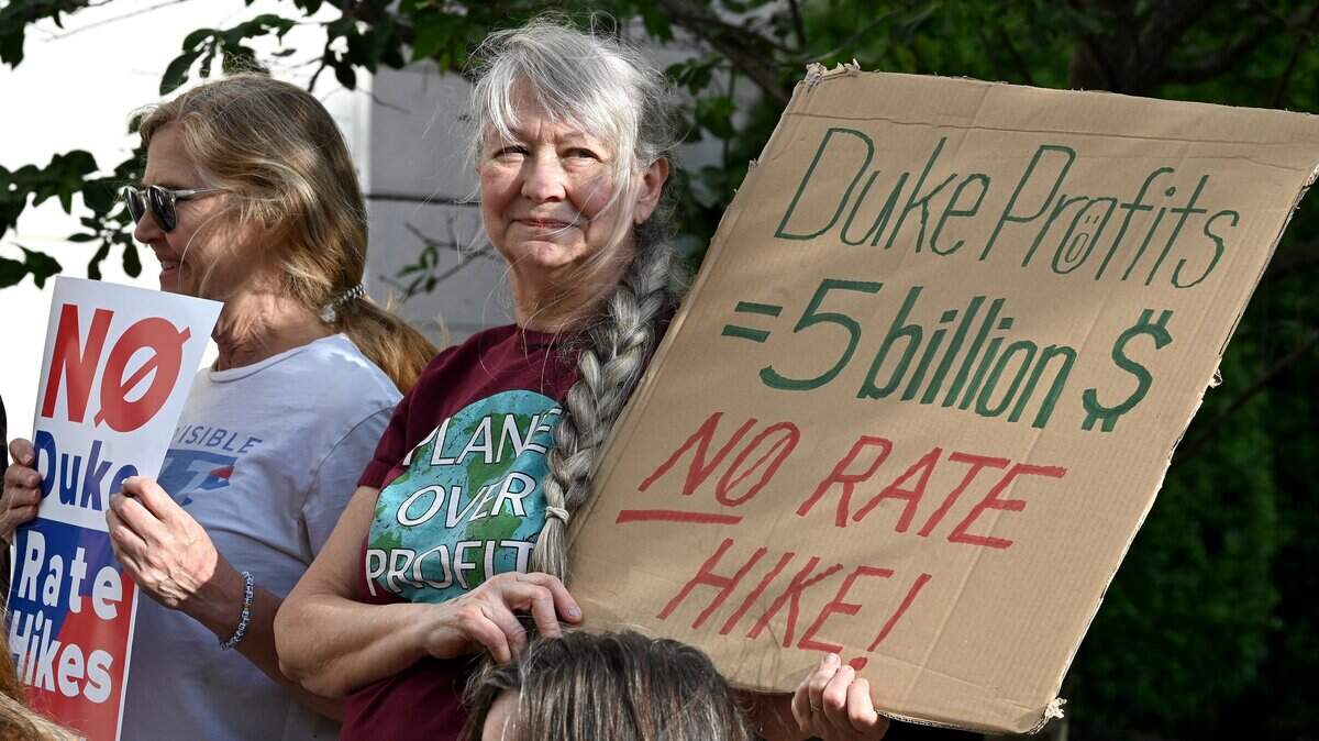 Concerned citizens gather for a rally outside the Mecklenburg County Courthouse in Charlotte, NC on Wednesday, April 29, 2026. The rally is in response to Duke Energy's request to increase residential customer's bills in North Carolina by about 18 percent. The rally preceded a North Carolina Utilities Commission hearing where commissioners listened to public testimony about the possible increase.