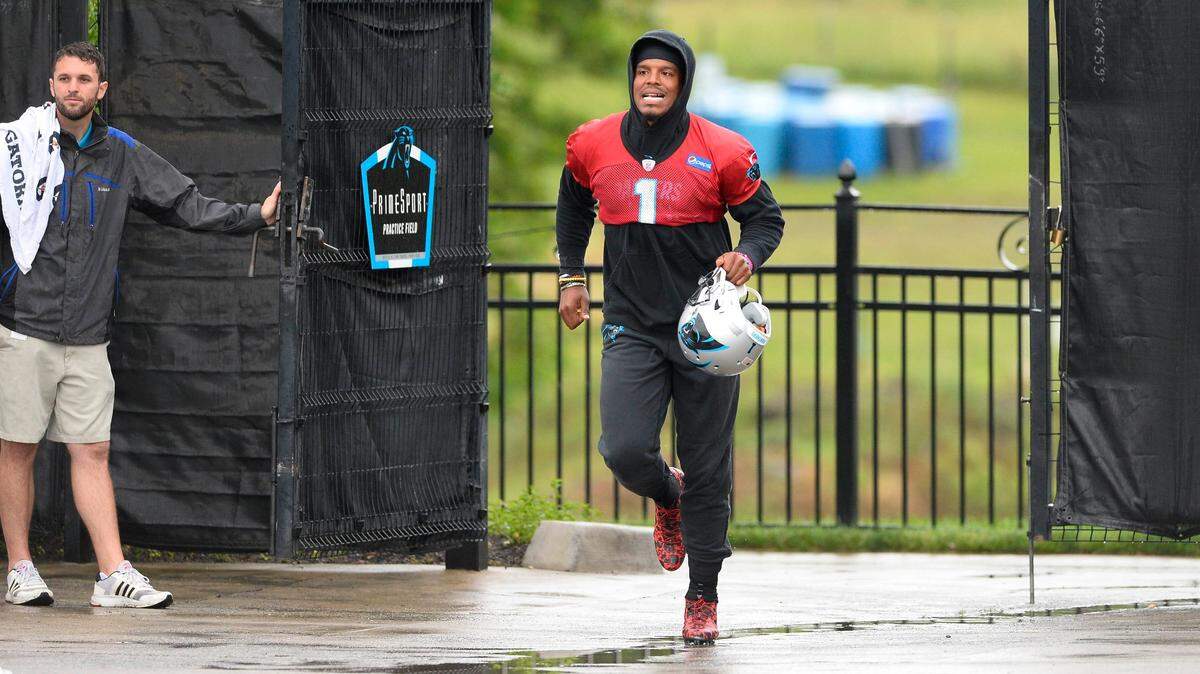 Carolina Panthers quarterback Cam Newton (1) runs through the gates of the practice field during organized team activities on Tuesday, May 29, 2018. Newton is able to throw with receivers immediately this year, a huge difference from last spring, when he had to rehabilitate his shoulder after surgery.
