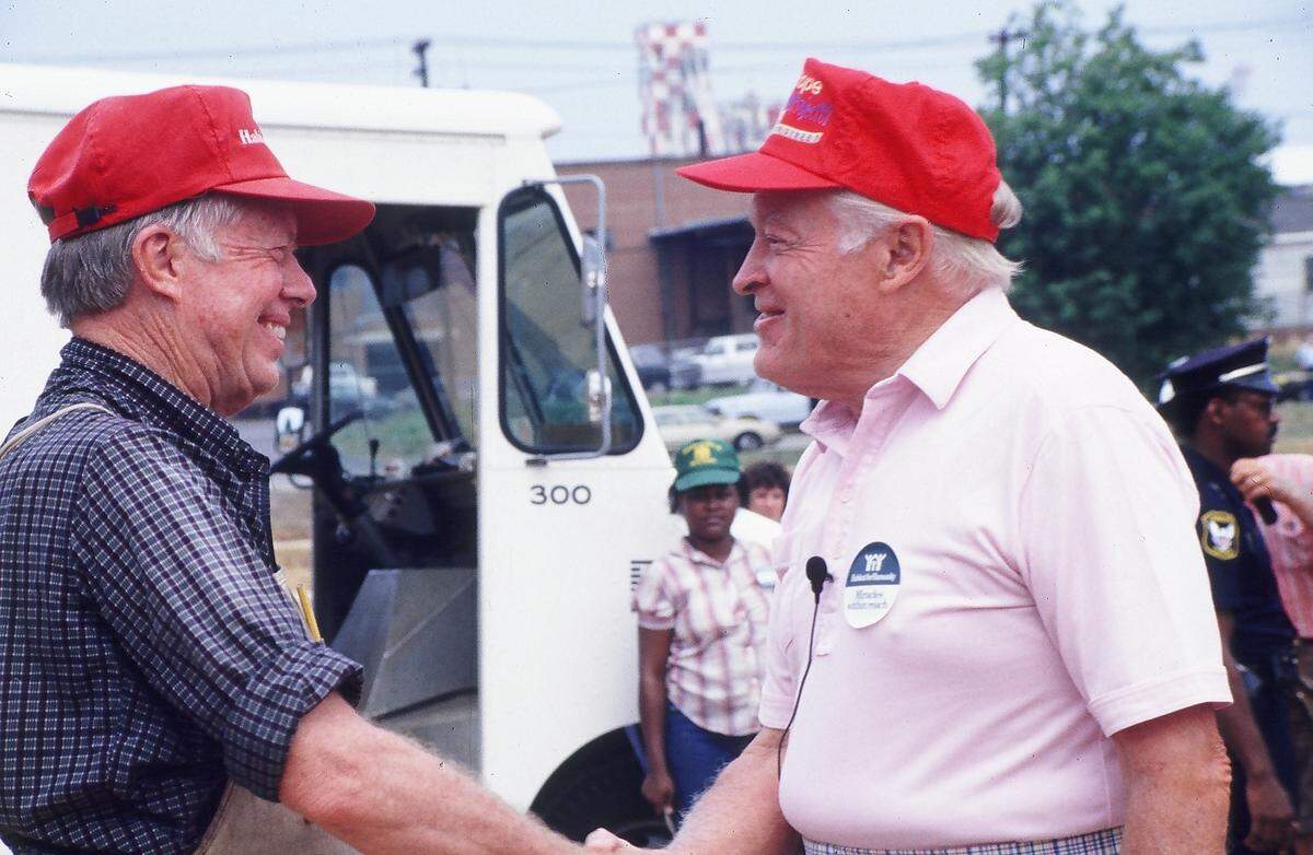 Jimmy Carter, left, greets Bob Hope at the work project site in 1987.
