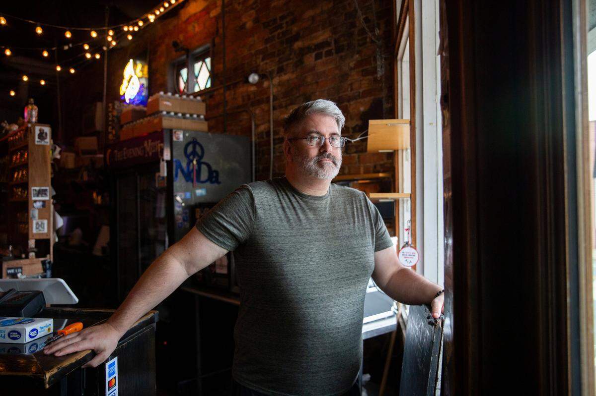 Joe Kuhlmann, founder and co-owner of The Evening Muse, stands inside his music venue in the NoDa neighborhood in a photo taken last August.