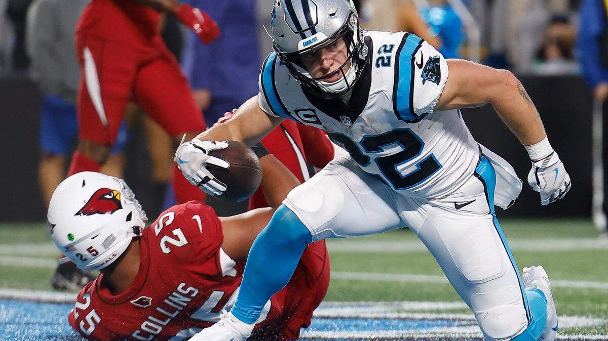 Carolina Panthers running back Christian McCaffrey (22) scores a touchdown over Arizona Cardinals linebacker Zaven Collins (25) during a game at Bank of America Stadium in Charlotte, N.C., Sunday, Oct. 2, 2022.