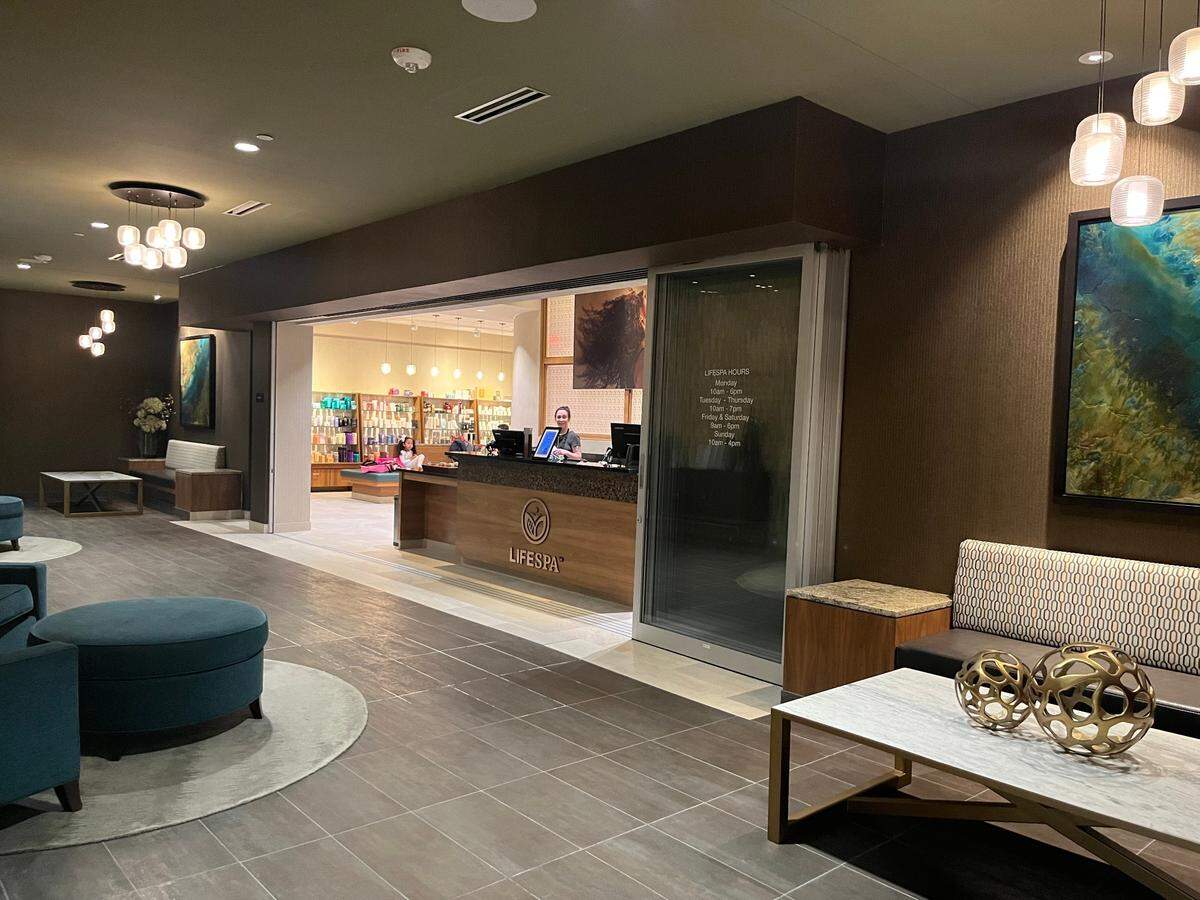 The waiting area at Life Time’s LifeSpa, where you can get a message, a facial, a haircut or even a mani-pedi.
