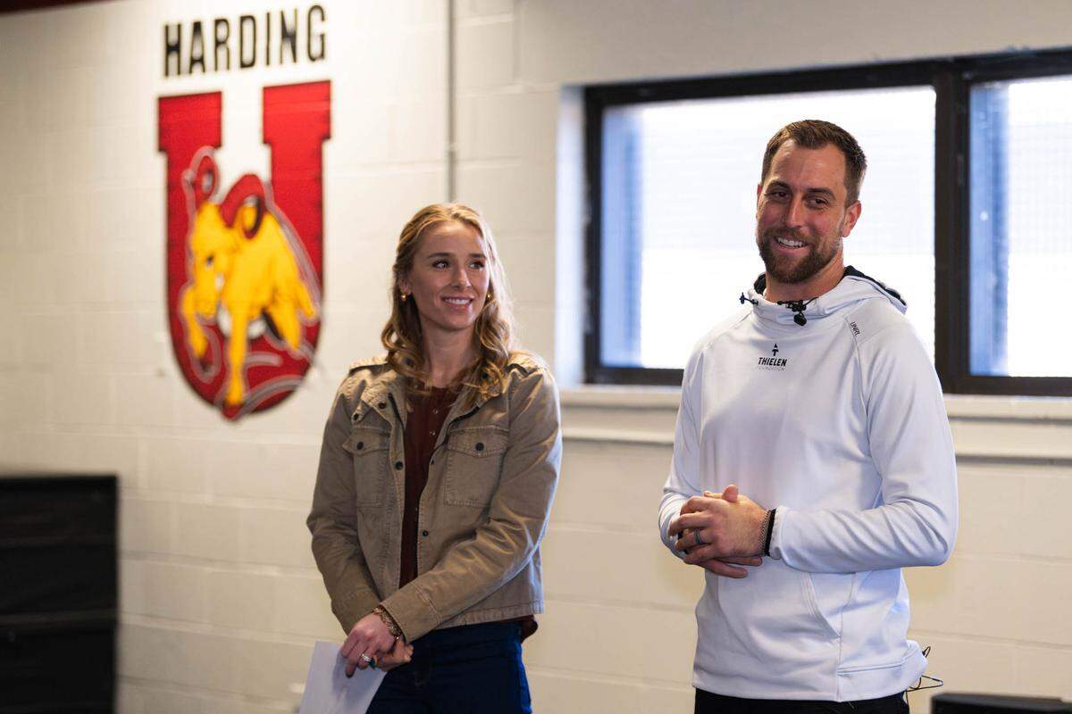 Caitlin and Adam Thielen, wide receiver for the Carolina Panthers, speak to students, teachers and coaches at Harding University about the school’s revamped weight room in Charlotte.