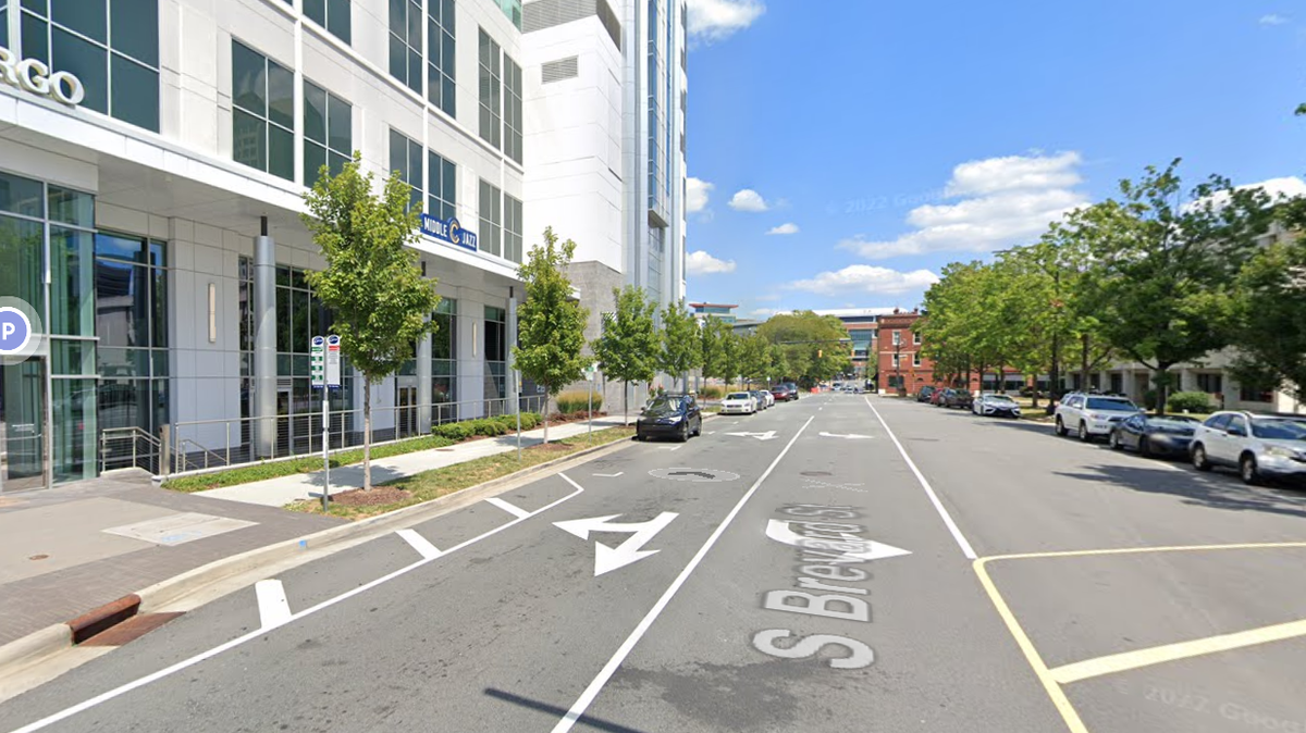 A 39-year-old man was arrested outside of an uptown bar on South Brevard Street Saturday after attacking another customer with a machete and brass knuckles.
