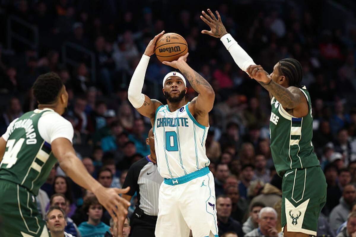 Miles Bridges of the Charlotte Hornets attempts a three point basket during the first quarter of the game against the Milwaukee Bucks at Spectrum Center.