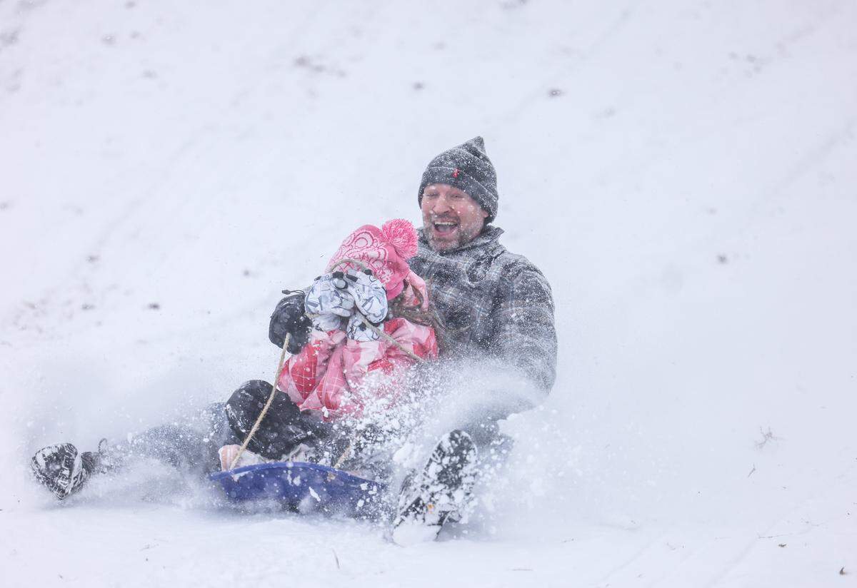 People sled in Cordelia Park in Charlotte, N.C., on Saturday, January 31, 2026.