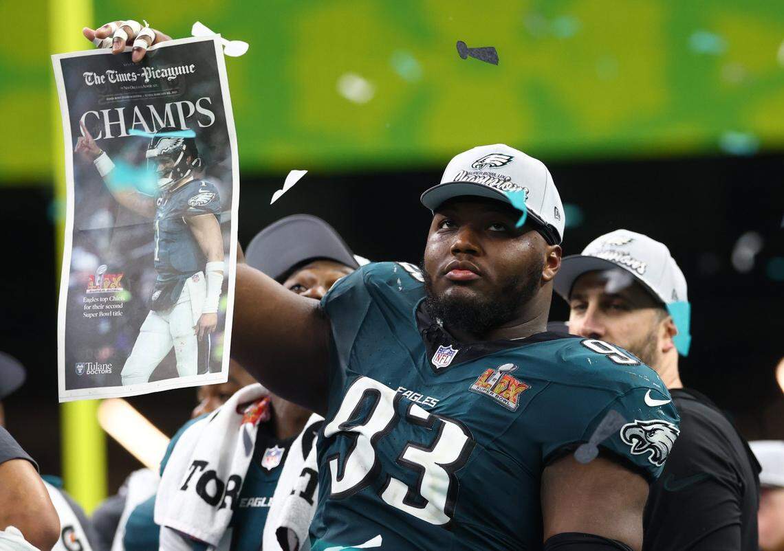 Feb 9, 2025; New Orleans, LA, USA;  Philadelphia Eagles defensive tackle Milton Williams (93) celebrates on the podium after defeating the Kansas City Chiefs in Super Bowl LIX at Ceasars Superdome. Mandatory Credit: Mark J. Rebilas-Imagn Images