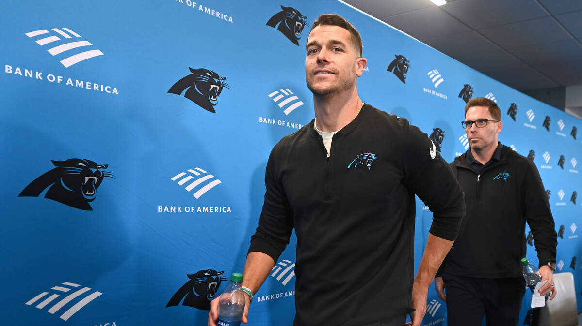 Carolina Panthers head coach Dave Canales, left, and general manager Dan Morgan, right, exit a pre-draft press conference at Bank of America Stadium on Thursday, April 18, 2024.