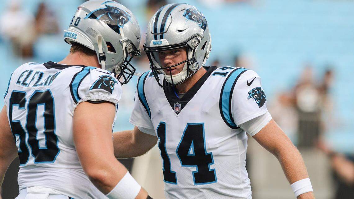 Panthers quarterback Sam Darnold, right, bumps helmets with guard Pat Elfleinduring during warmups before the preseason game against the Ravens on Saturday at Bank of America Stadium. Darnold will see more playing time Friday night.