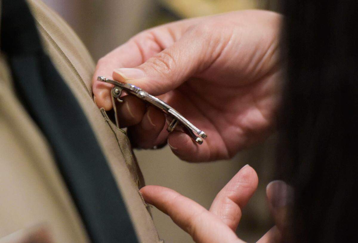Family and friends were invited to pin the newly graduated detention officers’ badges to their uniforms during the Mecklenburg County Detention Officer Certification Course graduation on Monday, June 8, 2023.
