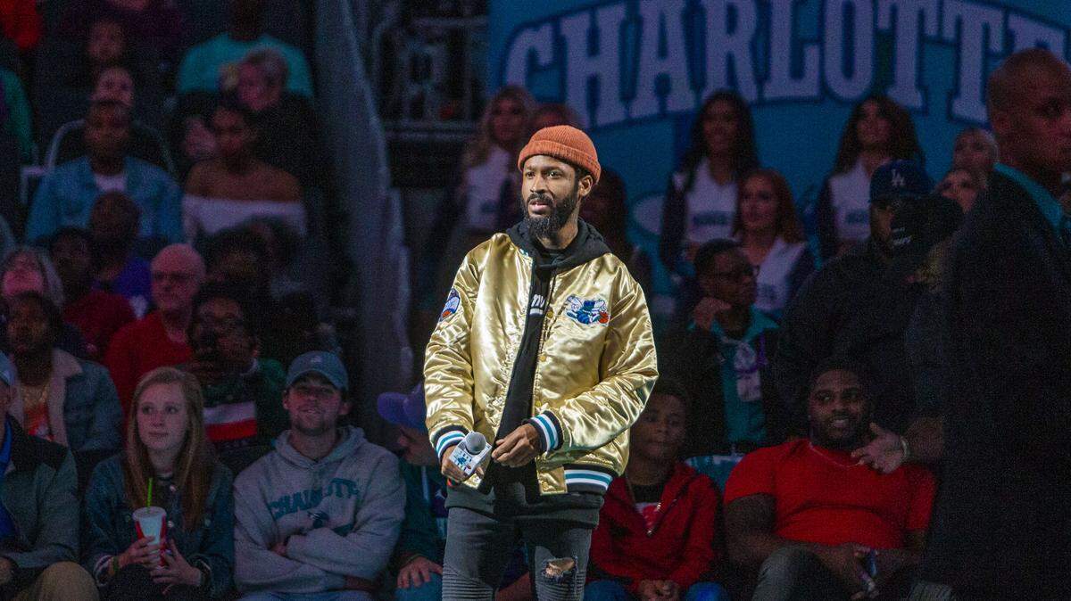 Lute, a local Charlotte artist, performs at halftime at the Spectrum Center in Charlotte on Saturday. Lute recently released his single, “GED (Gettin Every Dolla),” which is the first solo venture the Grammy-nominated artist has had since his album “West 1996 pt. 2” in 2017.