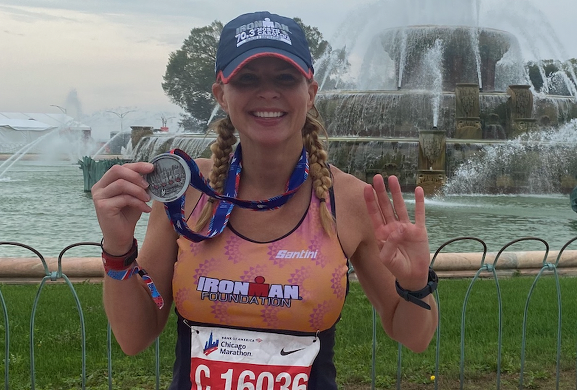 Shannon Spake poses with her finisher’s medal after completing the Chicago Marathon in a personal-best time in October 2021.