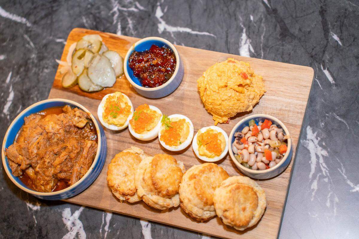 The Southern Board at Rally has braised pork, cheddar biscuits, dixie caviar, pimento cheese, habanero and bacon hot pepper jelly, deviled eggs with smoked trout roe and bread and butter pickles.