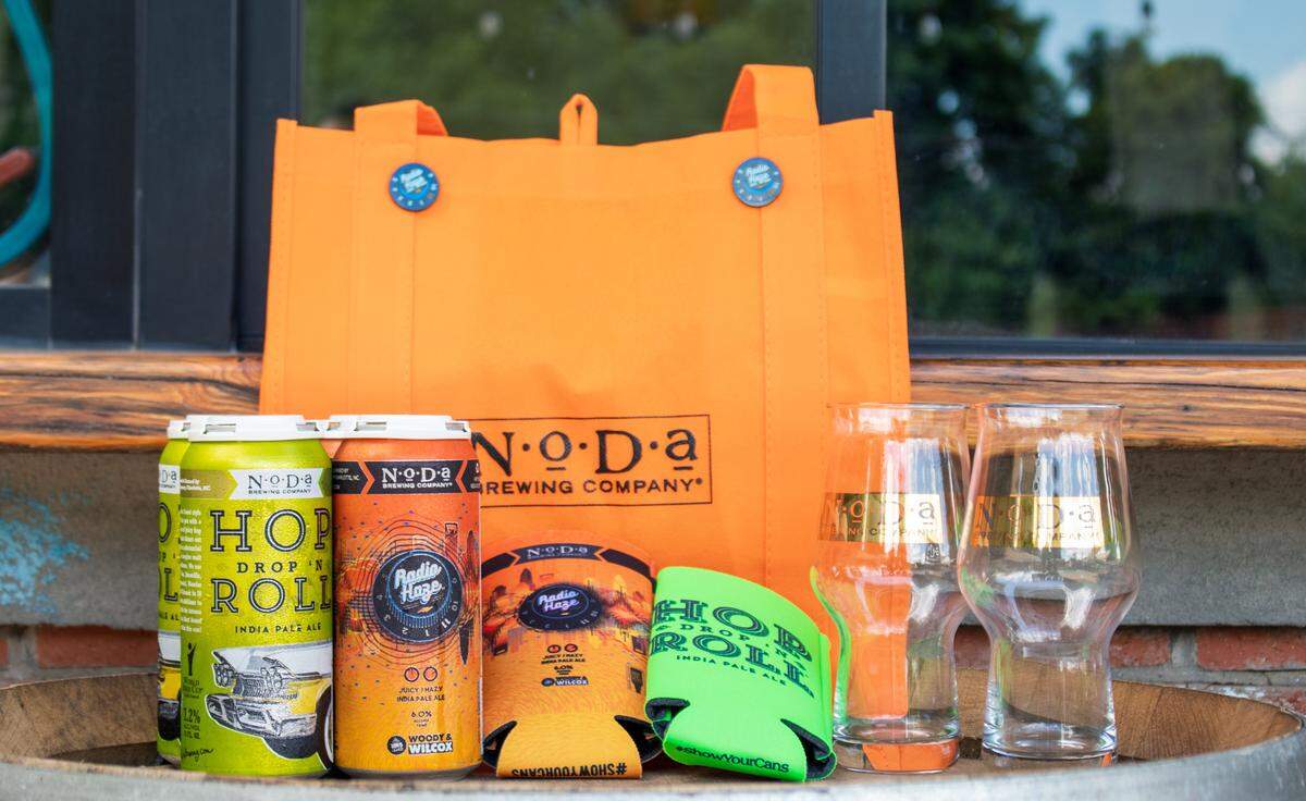 NoDa Brewing’s virtual IPA day celebration includes a tasting kit with a mixed IPA four-pack, koozies, 2 IPA tasting glasses, cheese, pretzels and more.