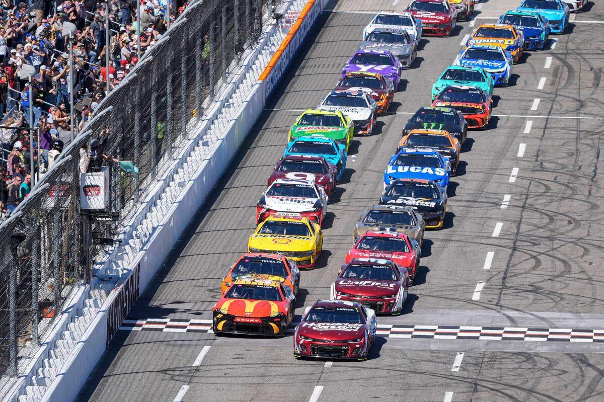 Apr 7, 2024; Martinsville, Virginia, USA; NASCAR Cup Series driver Kyle Larson (5) and driver Bubba Wallace (23) lead the field to the start during the Cook Out 400 at Martinsville Speedway.