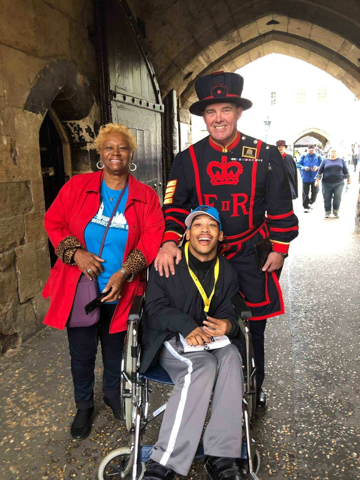 Saundra Adams (left) and her grandson Chancellor Lee Adams (center) pose in London in October 2019. The Adamses were guests of the “Roaring Riot” fan club, whose owner had been inspired to take the Adamses on an all-expenses-paid trip after listening to The Charlotte Observer’s “Carruth” podcast.