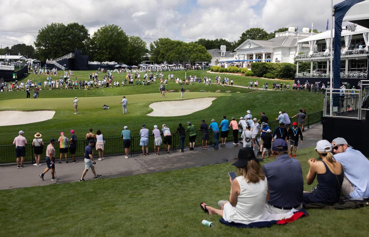 Fans watch players on the 18th hole during the second practice day at the 107th PGA Championship at Quail Hollow in Charlotte, N.C., on Wednesday, May 14, 2025.
